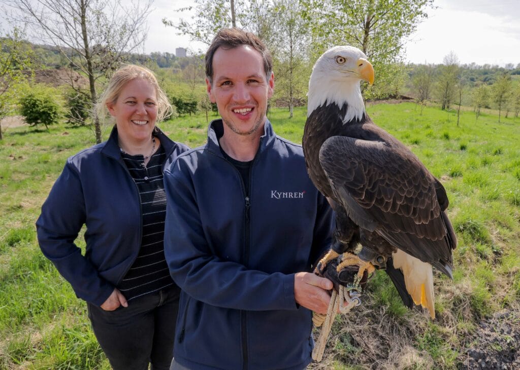 Image: Anna Warnecke, CEO, and Jimmy Robinson, Curator, Birds & Conservation with a bald eagle from The Lost Feather Show in Kynren - The Storied Lands.